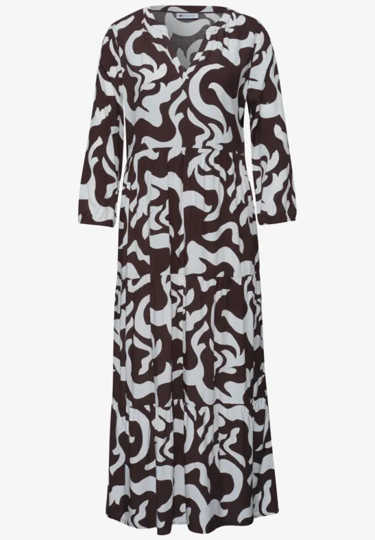 Maxi-jurk met lange mouwen, zwart-wit abstract dessin en V-hals.
