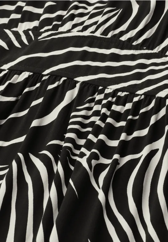 Zwart-witte stof met onregelmatig zebrapatroon.