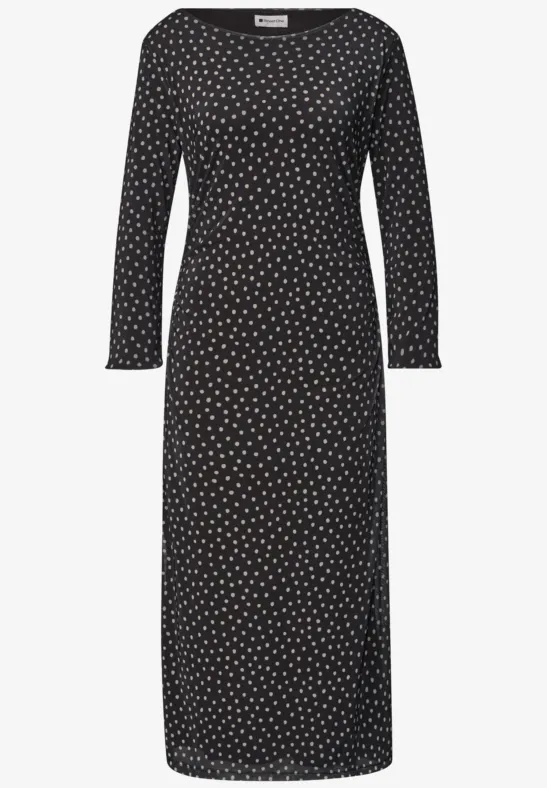 Robe midi noire à pois blancs, encolure arrondie et manches longues.