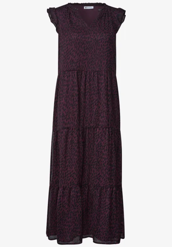 Robe longue fluide à manches courtes avec imprimé léopard discret et jupe à volants étagés.