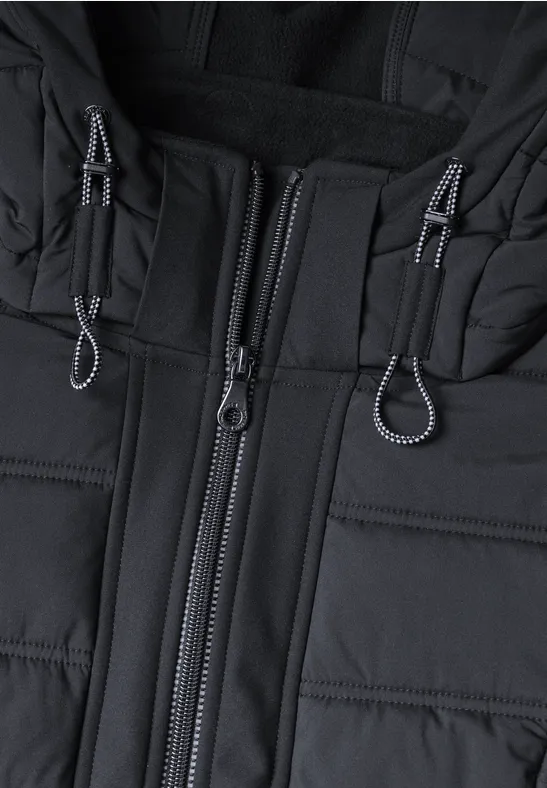 Veste matelassée noire avec fermeture éclair centrale et cordons au col