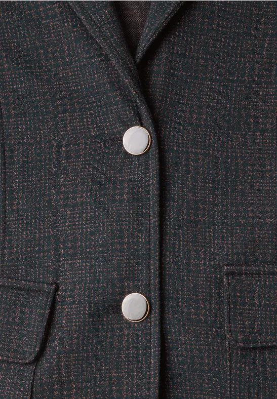 Veste en tweed noir avec boutons argentés et poches à rabat.