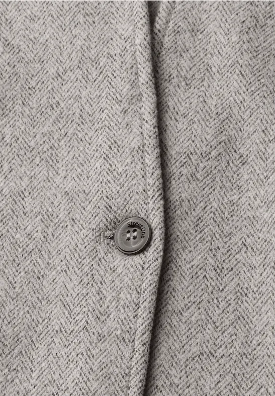 Close-up van grijze visgraatstof met een knoop.