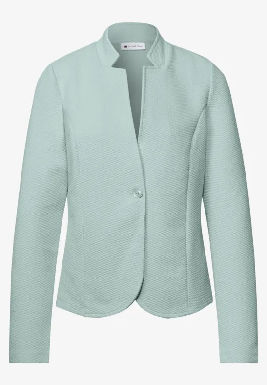Veste femme vert menthe à un bouton, coupe ajustée et manches longues.
