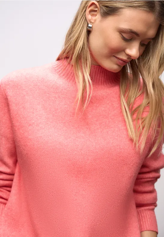 Pull avec détails de bande striking coral mel.
