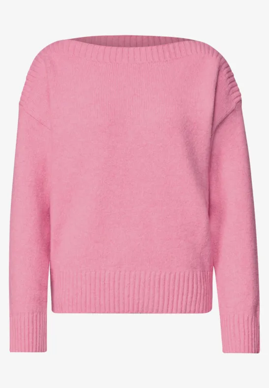 Ein pinker Langarm-Pullover aus Strick.
