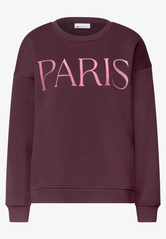 Sweat-shirt bordeaux avec inscription rose 'PARIS' sur la poitrine.