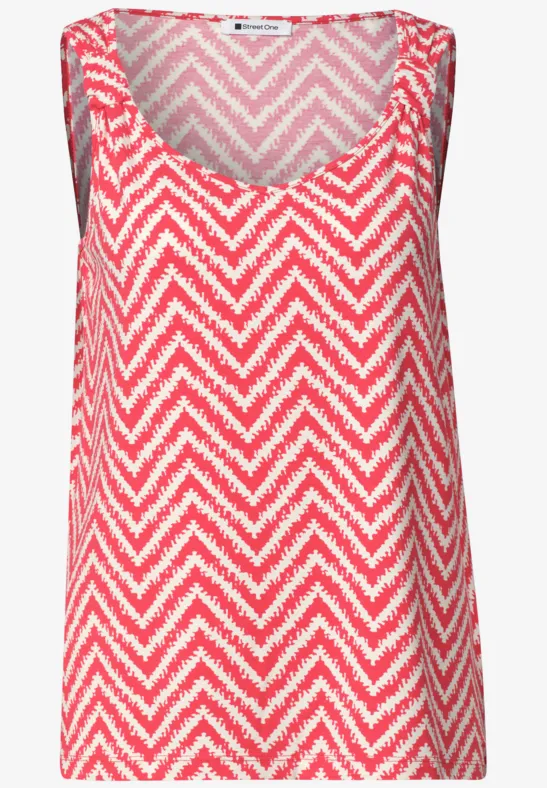 Rood-wit damesmouwloze top met zigzagmotief en V-hals.