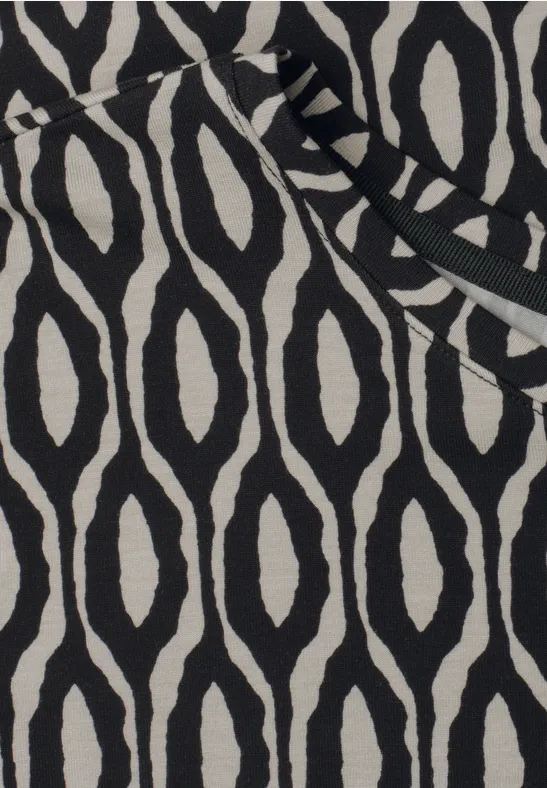 Zwart-beige stof met abstract golfvormig ovaalpatroon.