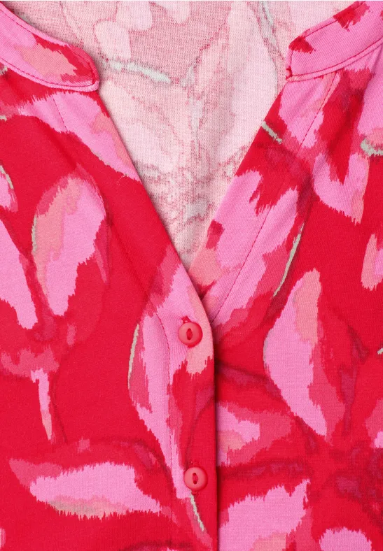 Close-up van rood-roze gemêleerde stof met knoopsluiting