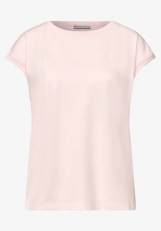 Un t-shirt femme uni rose pâle, manches courtes et encolure ronde.