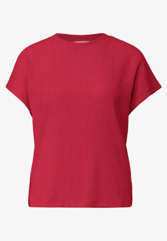 Rood T-shirt met korte mouwen en ronde hals.
