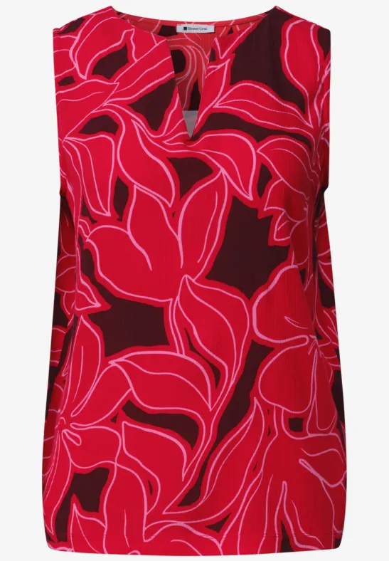 Mouwloze top met opvallende rood-roze bladprint en V-hals.