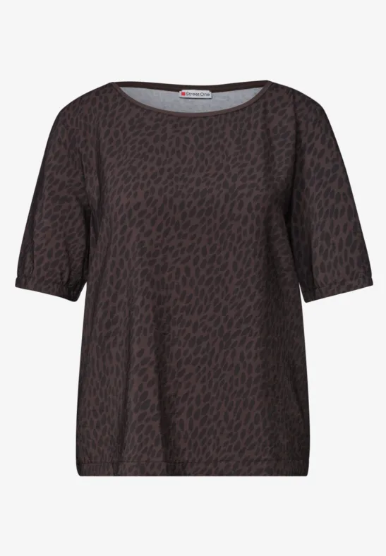 Blouse femme marron foncé à motif taches noires, manches courtes et col rond.