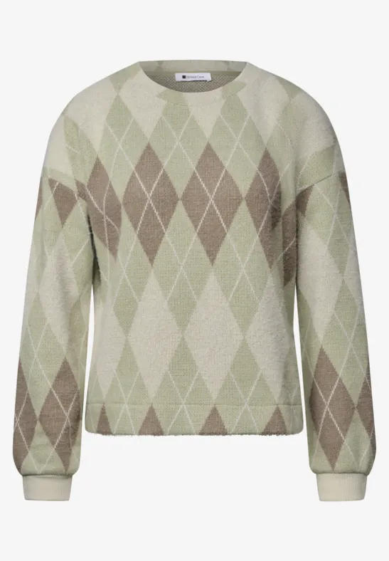 Pull en maille pastel vert avec motif losange beige et blanc en style argyle, manches longues, coupe droite.
