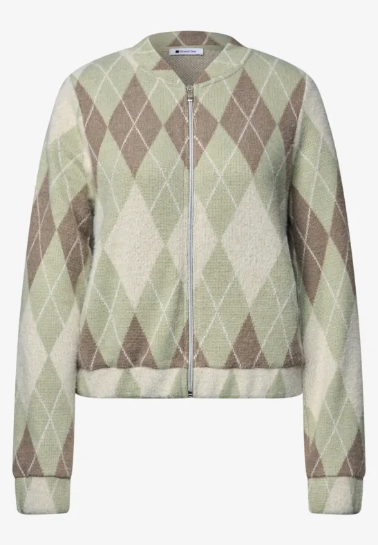 Cardigan court zippé en maille à motif losanges verts et beiges.