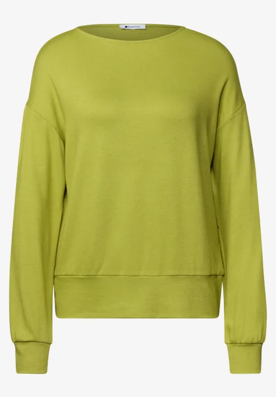 Ein schlichtes, langärmeliges Sweatshirt in leuchtendem Grün mit Rundhalsausschnitt.