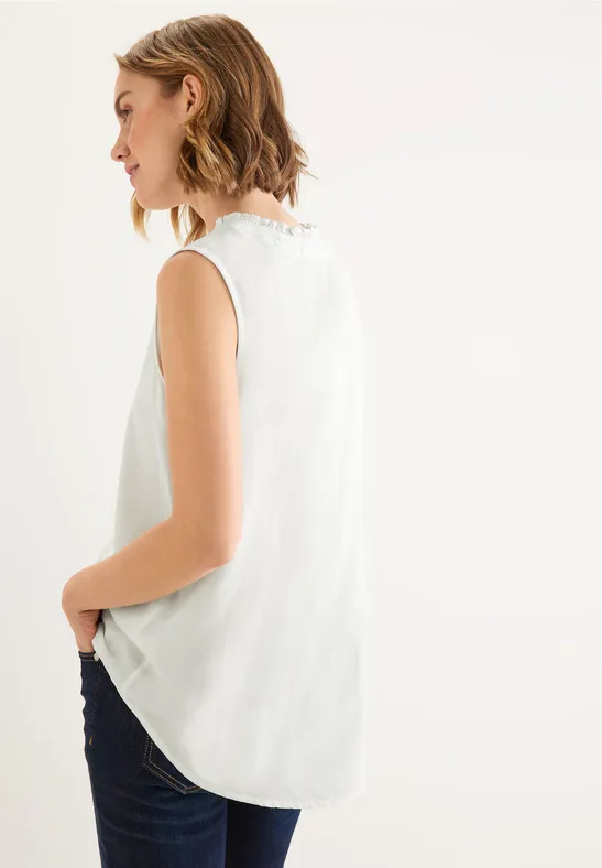 Ärmellose Bluse mit Rüschen off white