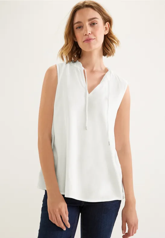 Ärmellose Bluse mit Rüschen off white