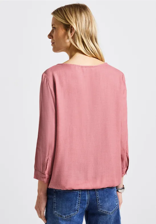 Gemêleerde blouse met ronde hals almond coral mel.