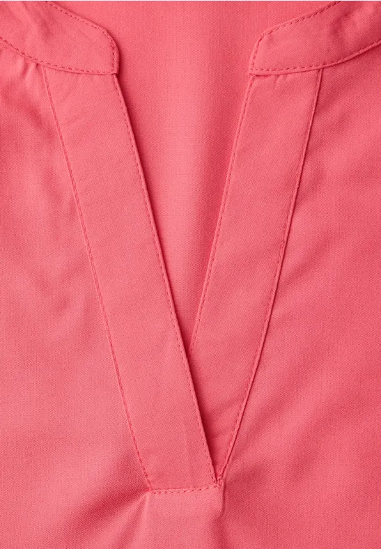 Blouse met gespleten hals en omslag striking coral
