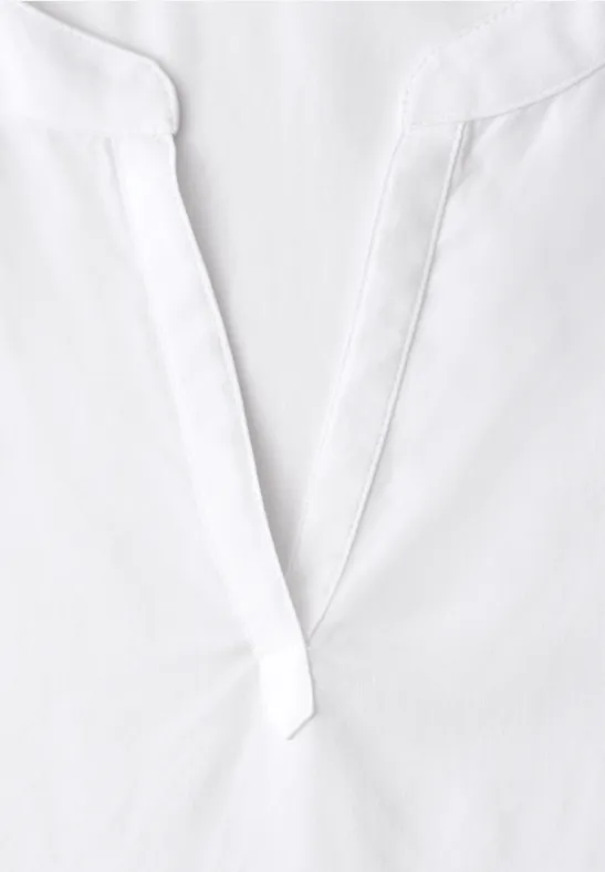 Witte bovenkleding met V-hals en subtiele kraag