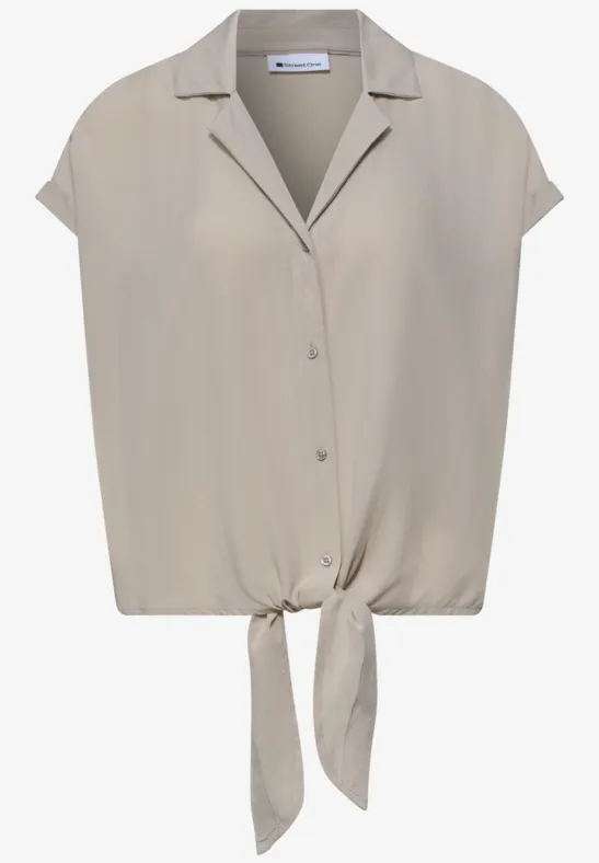 Beige kurzärmlige Damenbluse mit V-Ausschnitt, Knopfleiste und Knoten am Saum.