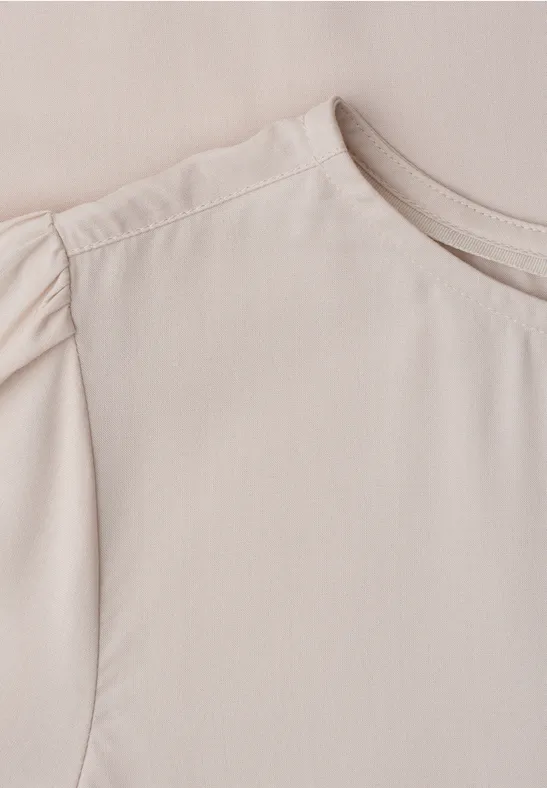 Beige damesblouse met ronde hals en geplooide mouwen