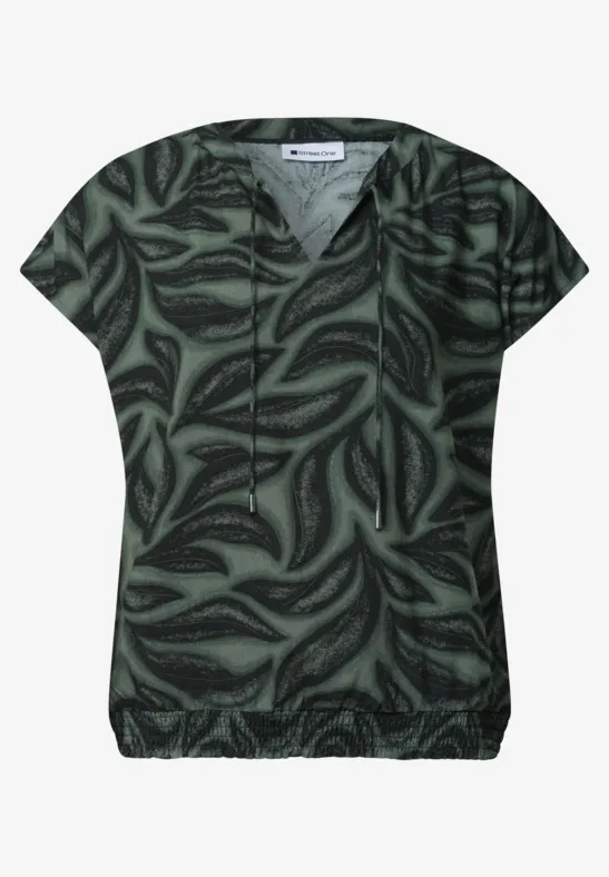 Donkergroen dames T-shirt met korte mouwen en abstract bladprint.