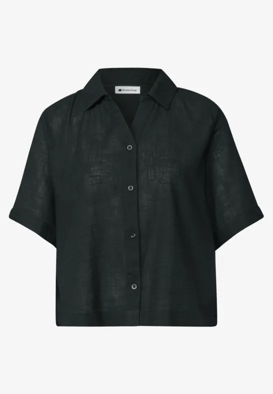 Chemisier noir à manches courtes, col classique et boutonnage intégral, coupe ample