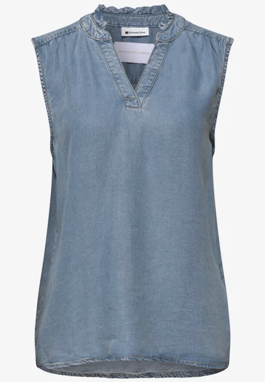 Mouwloze denim top met V-hals en sierlijke ruches aan de kraag.