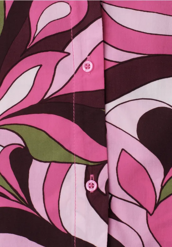 Stoff mit rosa-weißen und braun-grünen, abstrakten floralen Mustern und sichtbaren Knöpfen.