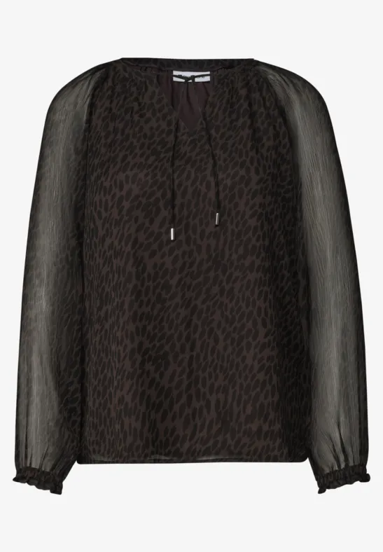 Blouse légère noire semi-transparente à imprimé animalier et poignets volantés