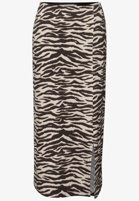 Jupe crayon midi beige à motif zèbre noir, fendue sur le côté.