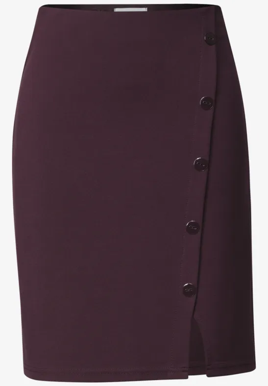 Donkerpaarse kokerrok met hoge taille, knoopsluiting aan de zijkant en split.