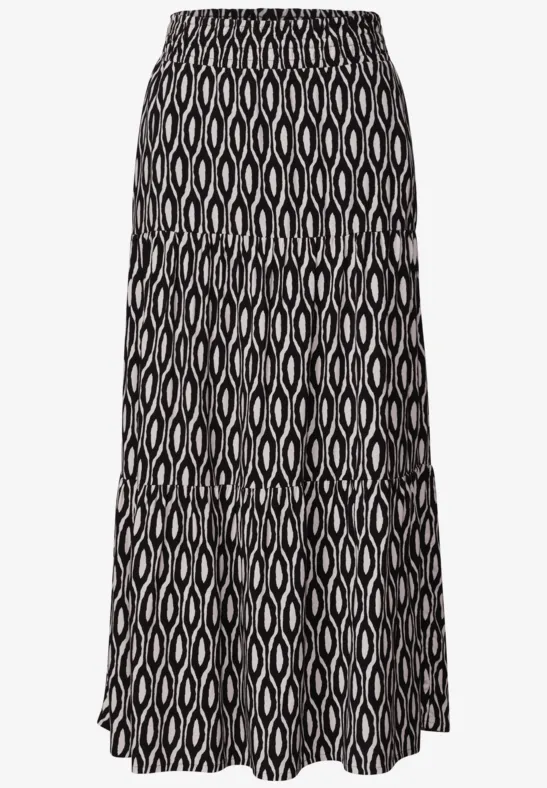 Zwarte midirok met beige, geometrisch ovalenpatroon en uitlopende, geplooide lagen