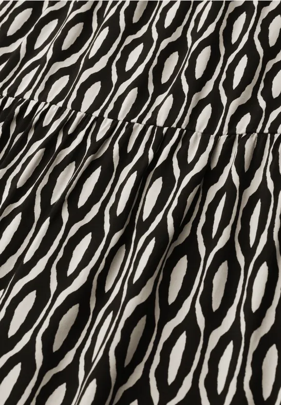 Zwart-witte stof met abstract golf- of ovaalmotief