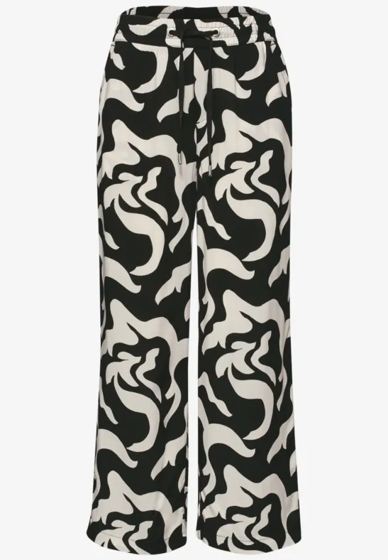 Zwart-witte broek met abstracte print en wijd vallende pijpen