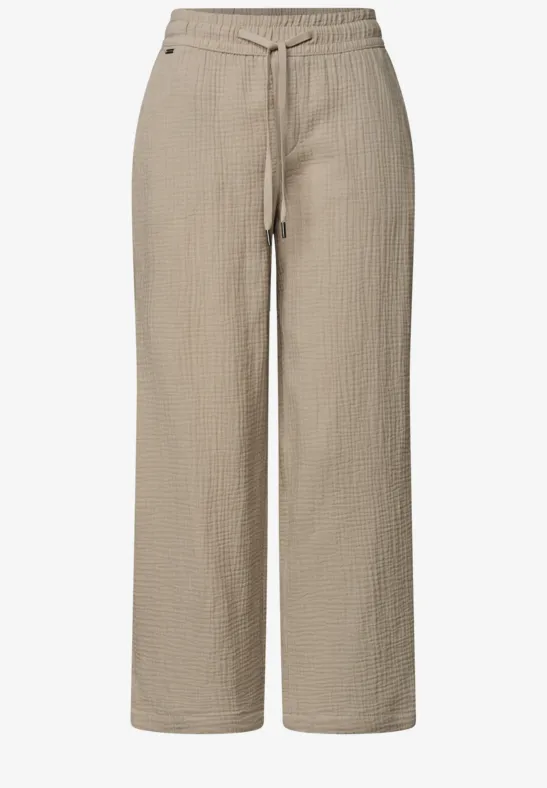 Licht beige, losse broek van gestructureerd katoen met elastische taille en trekkoord