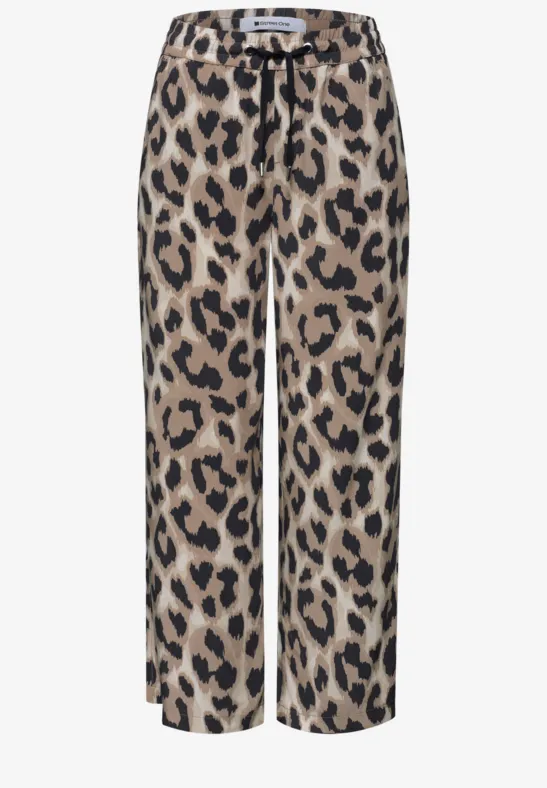 Pantalon ample à imprimé léopard, coupe droite, cordon de serrage, tons bruns et noirs.