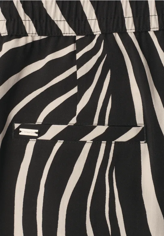 Zwart-witte zebraprint stof met geïntegreerde klepzak.
