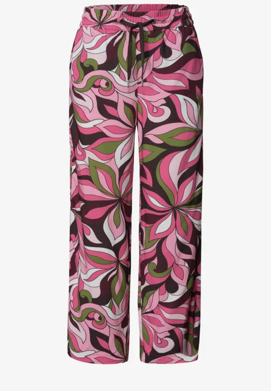 Weite Palazzo-Hose in Pink, Grün und Schwarz mit abstraktem Blumenmuster.