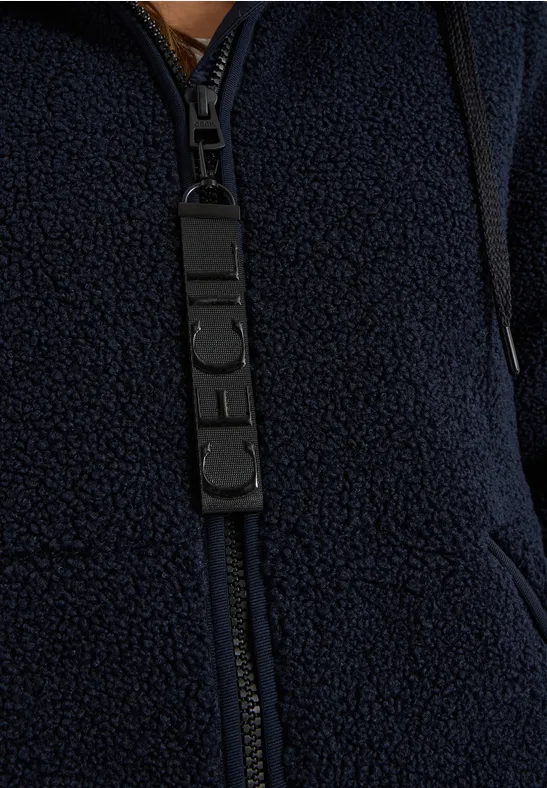 Blaues Teddy-Fleece-Jäckchen mit Reißverschluss und Taschen.