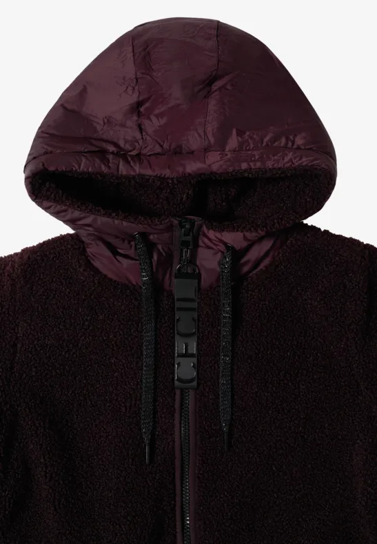Dunkle, bordeauxfarbene Kapuzenjacke mit weichem Teddy-Futter und Nylon-Details.