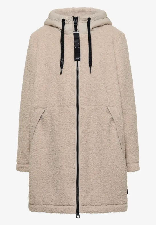 Beige teddyfleece jas met capuchon, rits voor, zijzakken, recht model tot over de knie.
