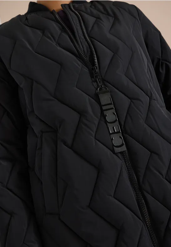 Veste matelassée noire à motif zigzag avec fermeture éclair
