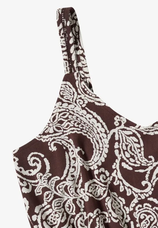 Top femme marron avec motif blanc, bretelles fines et broderie florale.