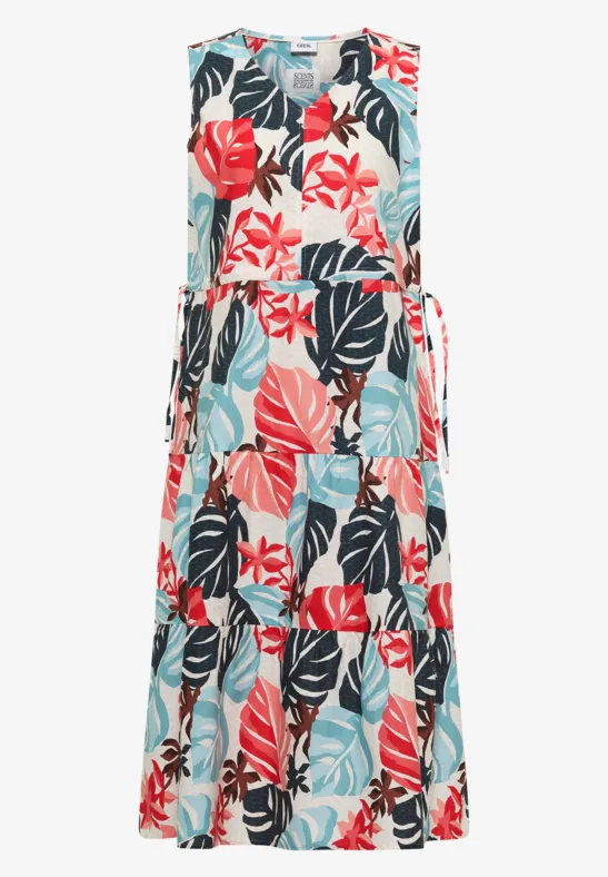 Mouwloze maxijurk met tropische bladeren- en bloemenprint in koraal, mint en zwart op wit, V-hals, ceintuur.