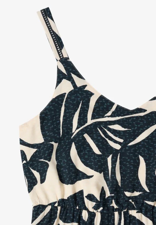 Ärmelloses Kleid mit schwarzen Blattmotiven auf beigem Hintergrund und dünnen Trägern.