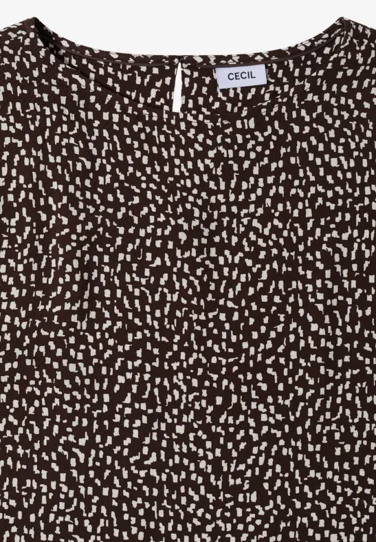 Haut marron sans manches à motif de petits points blancs et encolure ronde